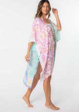 [Color: Sky/Seafoam] A model wearing a stunning mid length kimono in a blue mixed floral print. Featuring half length kimono sleeves, side slits, and an open front.