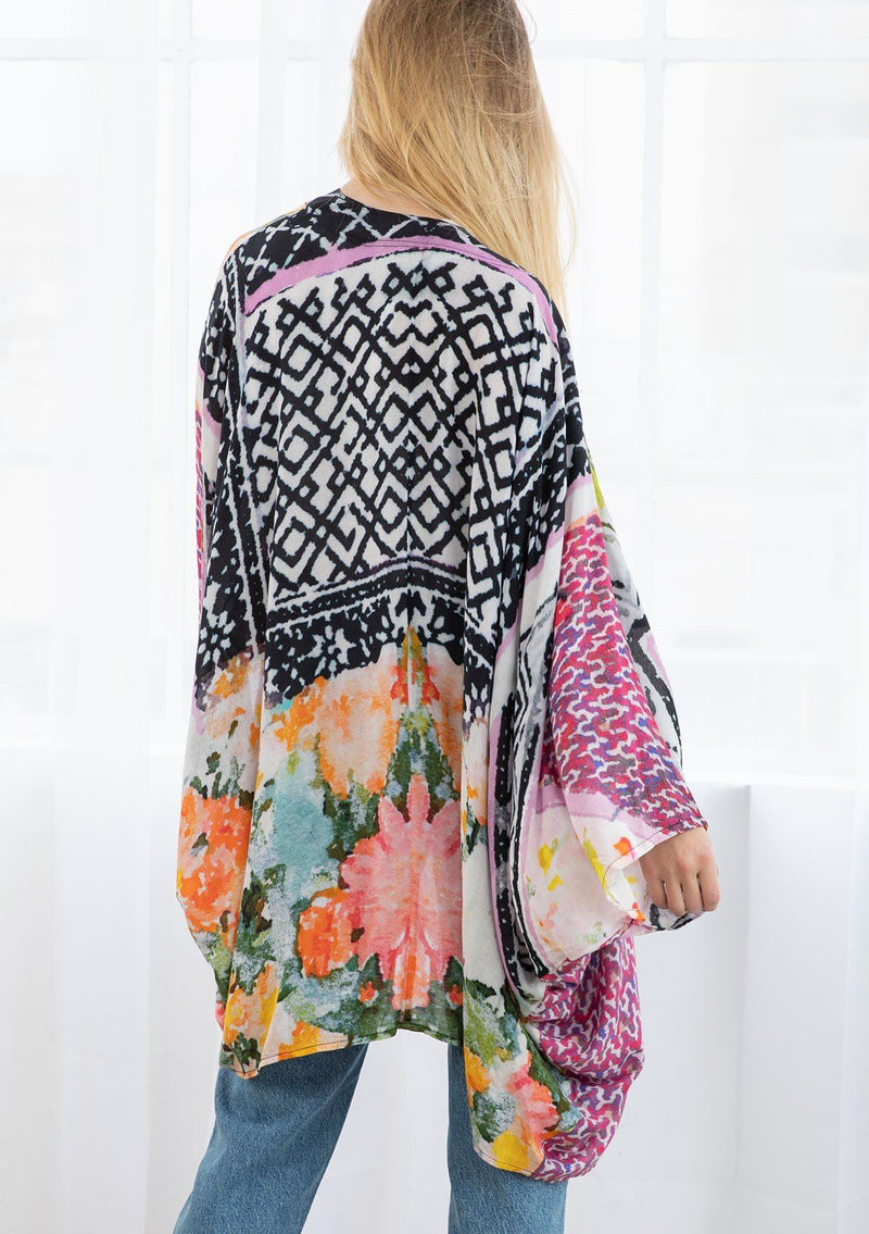 [Color: Black/Fuchsia Combo] A blond model wearing a mixed floral print mid length kimono. With a cocoon silhouette, kimono sleeves, and an open front.