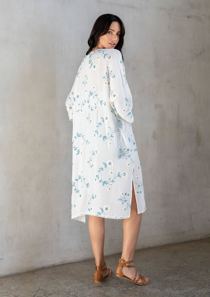 [Color: Ivory/Slate] A model wearing a bohemian white mid length kimono with floral embroidery. 