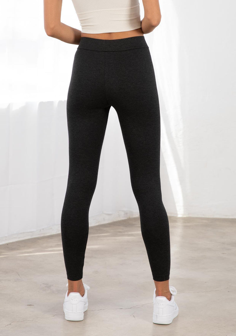 [Color: Charcoal] A model wearing a slim fit essential charcoal grey Ponte legging. With a slightly cropped leg and an elastic waist for easy pull on. 