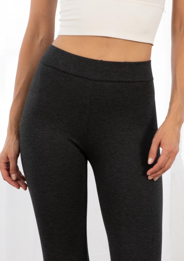 [Color: Charcoal] A model wearing a slim fit essential charcoal grey Ponte legging. With a slightly cropped leg and an elastic waist for easy pull on. 