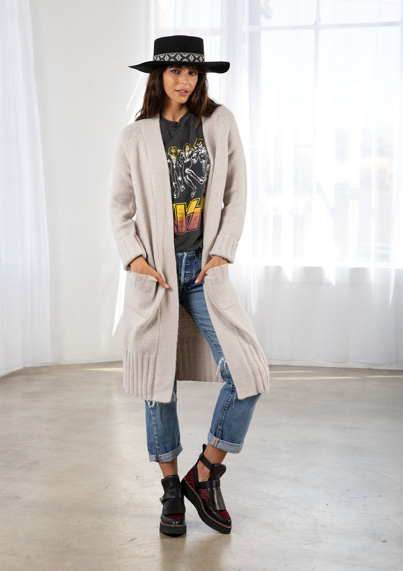 [Color: Light Taupe] Dreamy mid length cardigan. Featuring an easy open front, essential front patch pockets, and contrast ribbed trim detail. The cozy shawl neckline rounds out this comfortable yet flattering sweater.