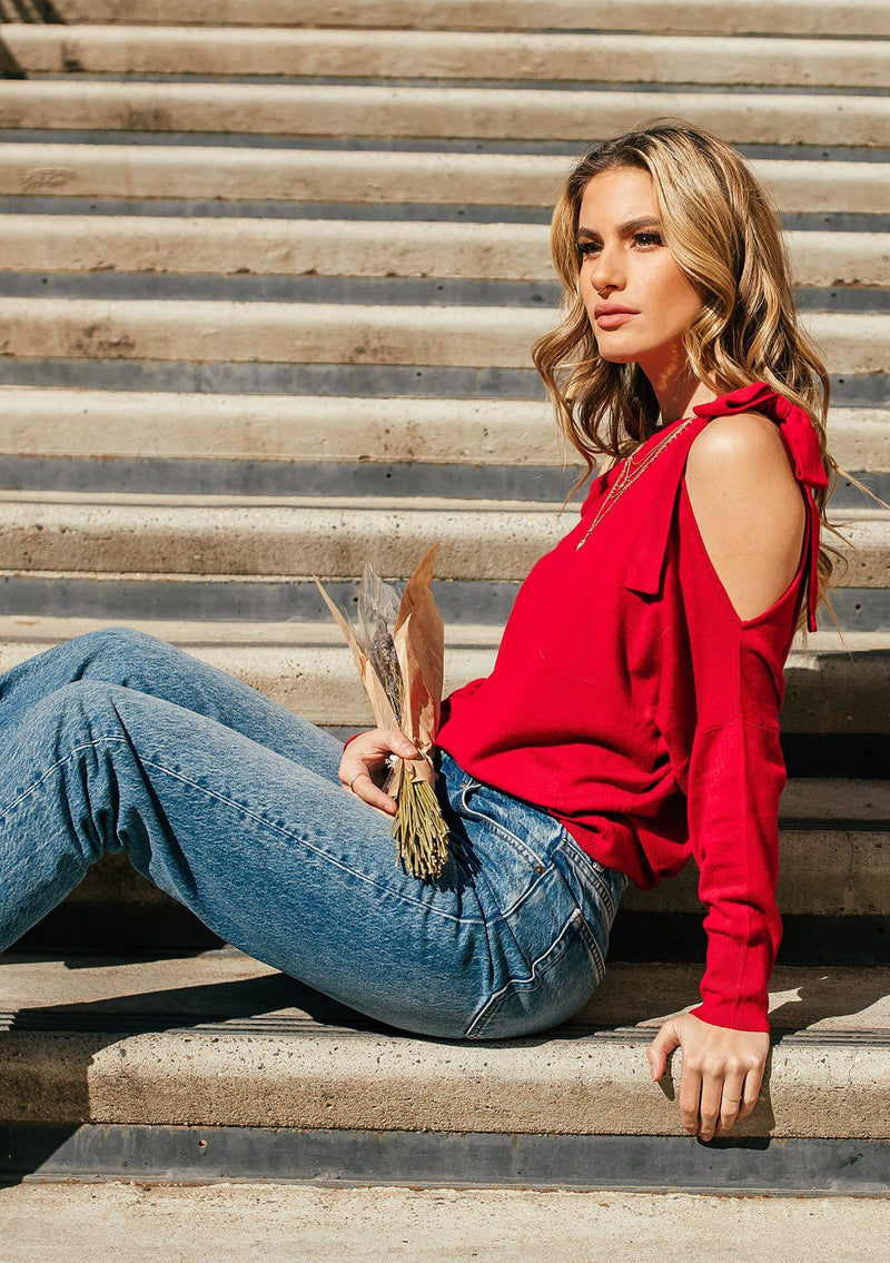 [Color: Garnet] A girl wearing a red oversized cozy pullover sweater.