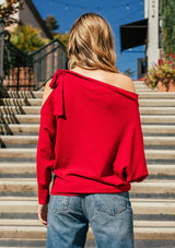 [Color: Garnet] A girl wearing a red oversized cozy pullover sweater.