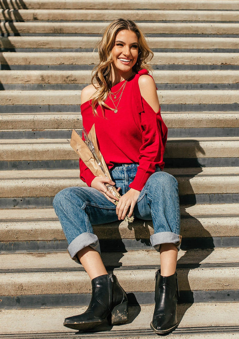 [Color: Garnet] A girl wearing a red oversized cozy pullover sweater.