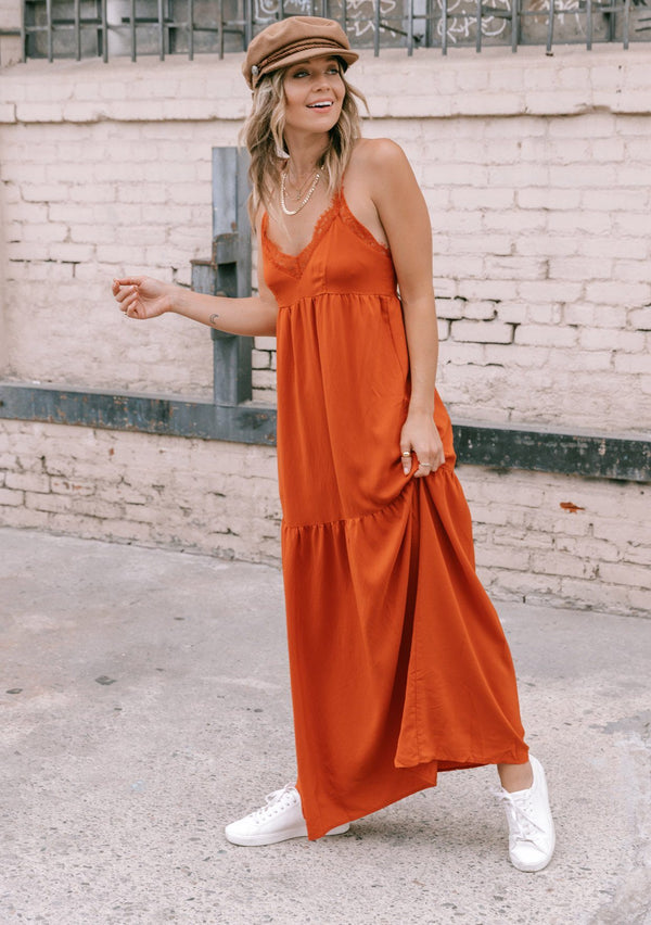 [Color: Rust] Inspired by lingerie but designed for outside the bedroom, our sexy tiered slip maxi dress is perfect for any special occasion. Featuring a delicate lace trim v neckline, a flirty tiered skirt, and pretty lace button up racerback.