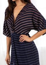 [Color: Navy/Blue] A bohemian maxi dress in a gradient stripe print. With half length kimono sleeves, a deep v neckline, a front slit, and a front knot detail at the waist. 