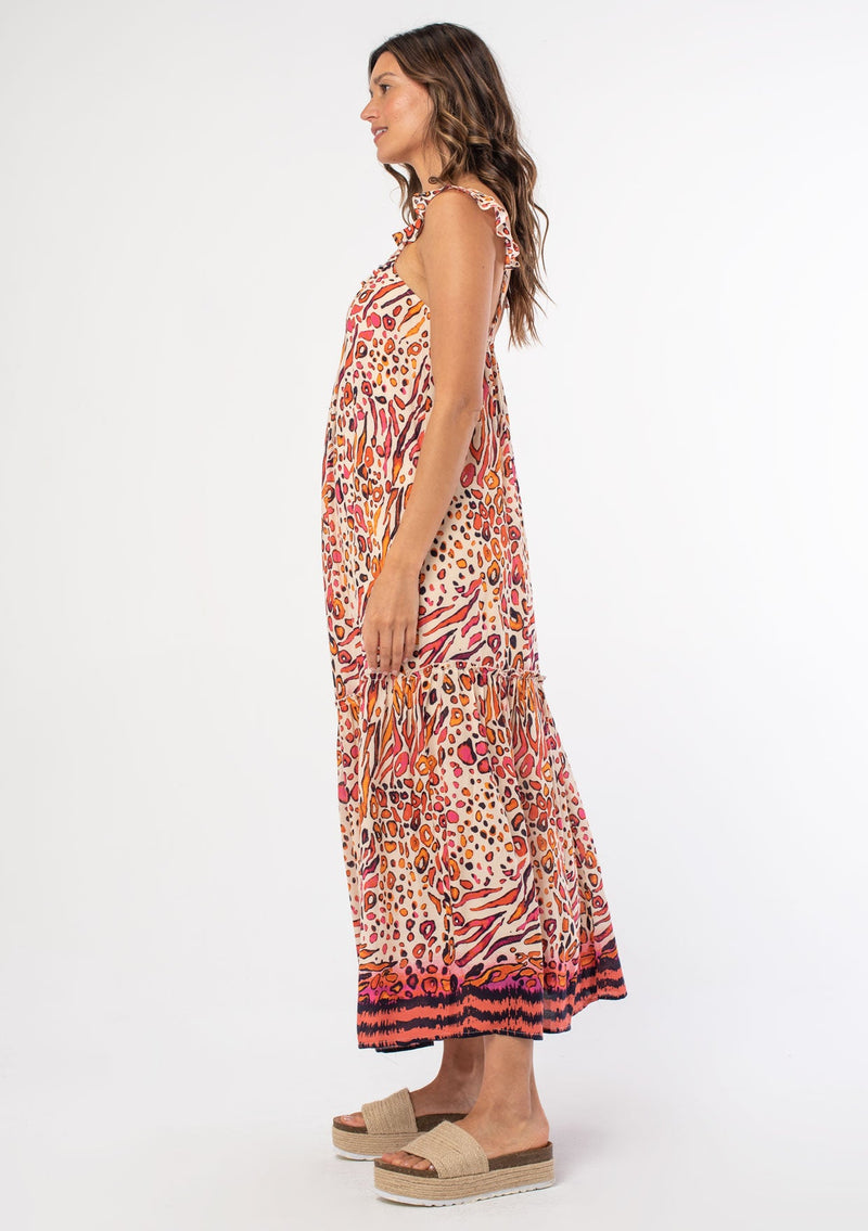 [Color: Natural/Fuchsia] A woman wearing a pink and natural abstract leopard print sleeveless maxi dress with a flowy relaxed fit and ruffled tank top straps. 