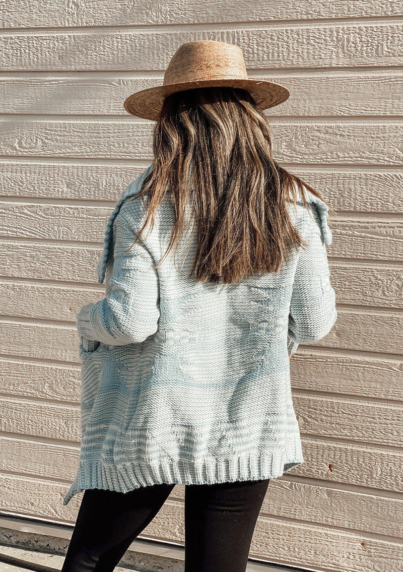 [Color: Sky/Ivory] A beautiful chunky knit cardigan with a shawl collar and ribbed detail. 