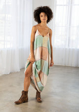 [Color: Natural/Mint] A model wearing a sleeveless patchwork paisley maxi dress. With a deep v neckline in front and back, adjustable spaghetti straps, and side pockets.