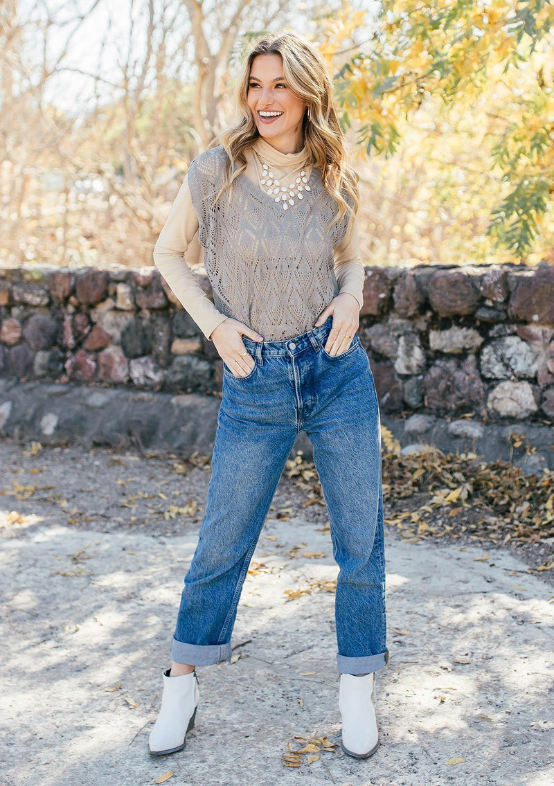 [Color: Light Grey] Girl wearing a tan crochet sweater vest 