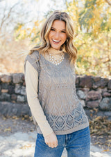 [Color: Light Grey] Girl wearing a tan crochet sweater vest 