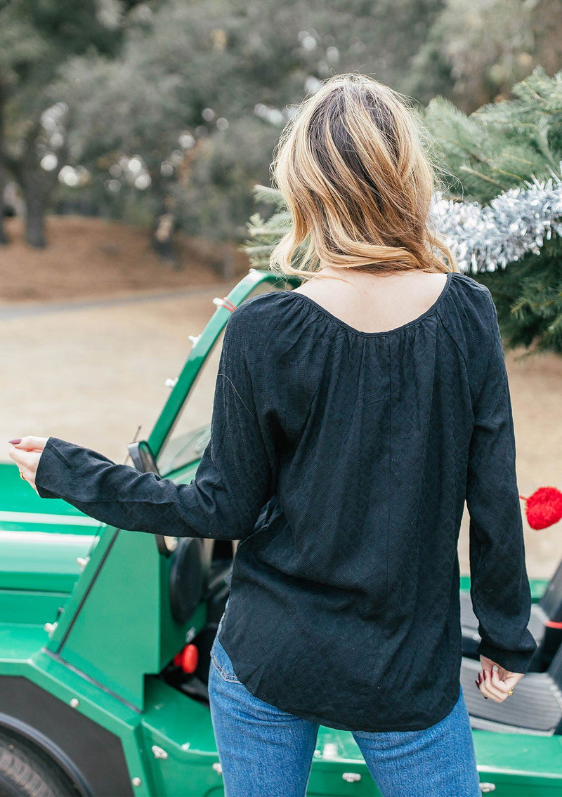 [Color: Black] Girl wearing a beautiful flowy bohemian peasant top.