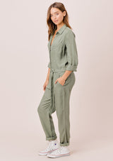 [Color: Olive] Lovestitch olive long sleeve, tencel, belted utility jumpsuit with paint splatter.