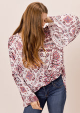 [Color: Oatmeal/Rose] Lovestitch Paisley printed, surplice top with ruffled neckline and dramatic bell sleeves. 