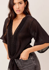 [Color: Vintage Black] Lovestitch black Lightweight crinkle cotton, eyelet trimmed top with tie detail at the waist. 