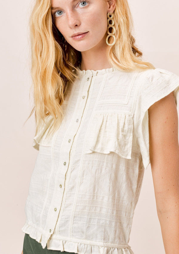 [Color: Vanilla] A pretty bohemian chic top in a multi textured cotton. Featuring delicate lattice trim inserts, a high neckline, and flirty ruffle details throughout.